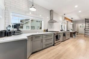 Fridge, microwave, oven, stovetop - The Modern Manor. A two bedroom, with loft, located in the heart of Puyallup.  (Puyallup)