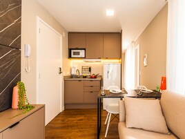 Classic Apartment, Balcony | Private kitchen | Fridge, microwave, cookware/dishes/utensils, dining tables