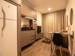 Comfort Apartment | Private kitchen | Fridge, microwave, cookware/dishes/utensils, dining tables