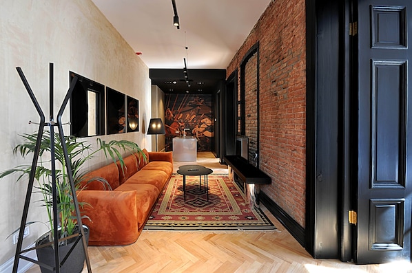 Suíte grand | Área de estar | TV de tela plana