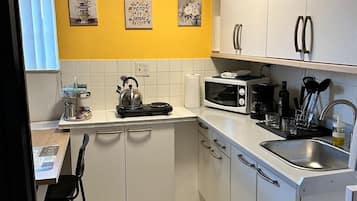 Microwave, stovetop, coffee/tea maker, cookware/dishes/utensils