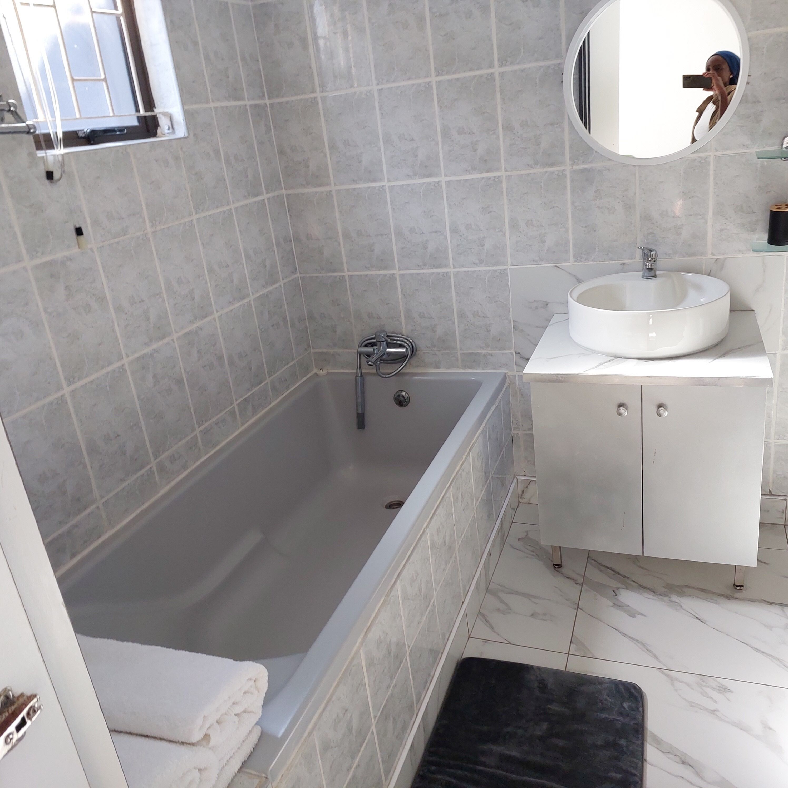 Shower, towels, soap, toilet paper
