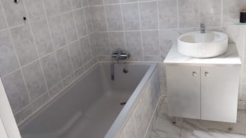 Shower, towels, soap, toilet paper