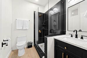Shower, towels, soap, toilet paper