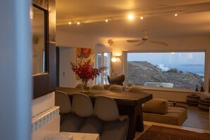 Eleni's Mykonian House | Living area | 75-inch Smart TV with cable channels, books - Flaskos Village Mykonos   (Mykonos)