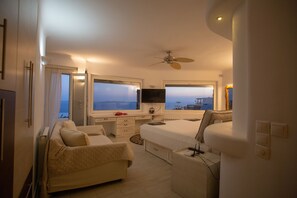 Eleni's Mykonian House | Living area | 75-inch Smart TV with cable channels, books - Flaskos Village Mykonos   (Mykonos)