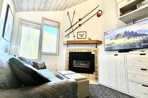 Bright space with top to bottom views of the alpine forest on The Corridor.