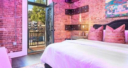 Chic Downtown Retreat | Fireplace | Game Area
