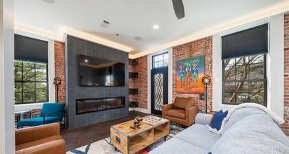 Chic Downtown Retreat | Fireplace | Game Area
