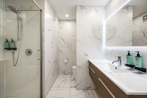 Shower, hair dryer, towels, soap