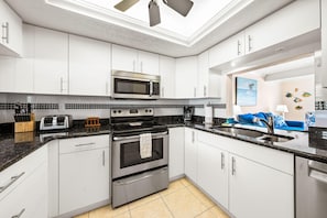 Condo, Multiple Beds (308) | Private kitchen | Full-size fridge, microwave, oven, stovetop - Sea Shell by Beachside Management (Siesta Key)