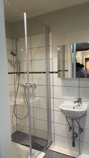 Shower, eco-friendly toiletries, hair dryer, towels