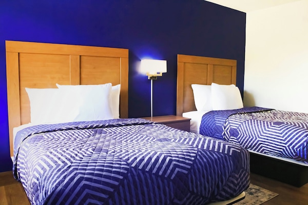 Basic Room, 2 Double Beds, Non-Smoking, Exterior Entry | Laptop workspace, free WiFi, bed sheets