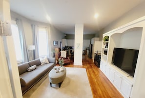 Smart TV, fireplace, table football, books