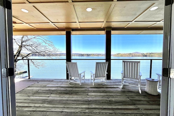 Bunk room view out to 2nd floor deck and lake view.