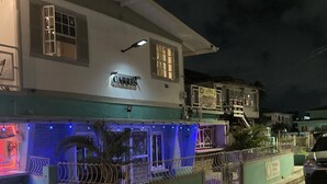 A building with a sign reading "CARRIS" and a gated entrance. - Carris (Georgetown)