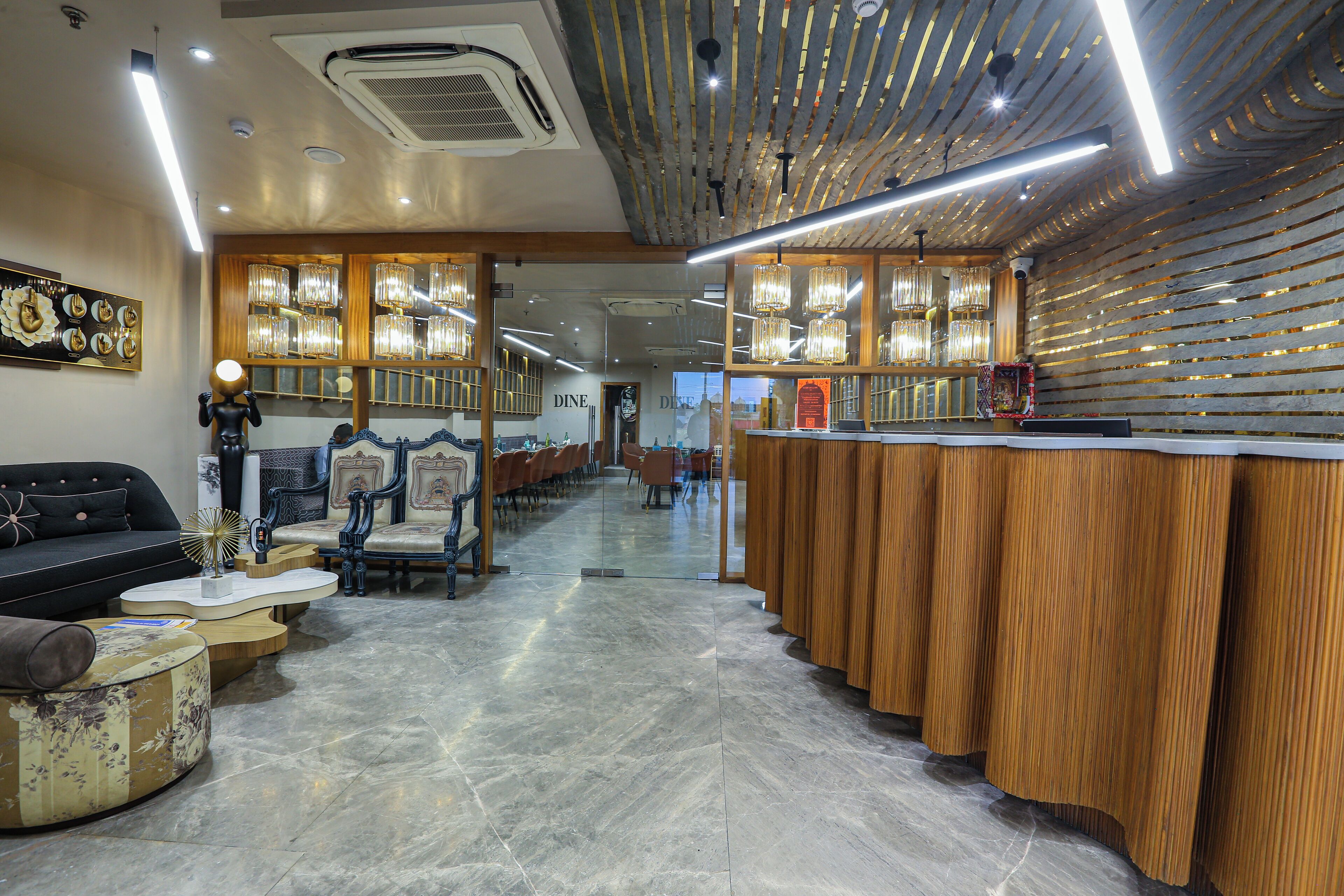 A modern interior with a bar area, seating, and a polished floor.