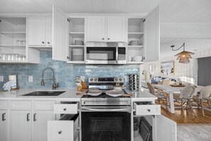 Fridge, microwave, oven, stovetop - Tranquil Tides - 5BR Waterfront w/ Heated Pool, Fire Pit, Grill (North Myrtle Beach)