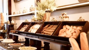 A buffet with various food items displayed in trays.