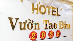 A hotel sign with the name "HOTEL VUÔN TĂO ĐẠN" and the year "2025". - Vuon Tao Dan Hotel Near Ben Thanh Market (Ho Chi Minh City)