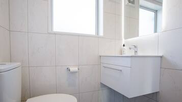 Eco-friendly toiletries, hair dryer, towels