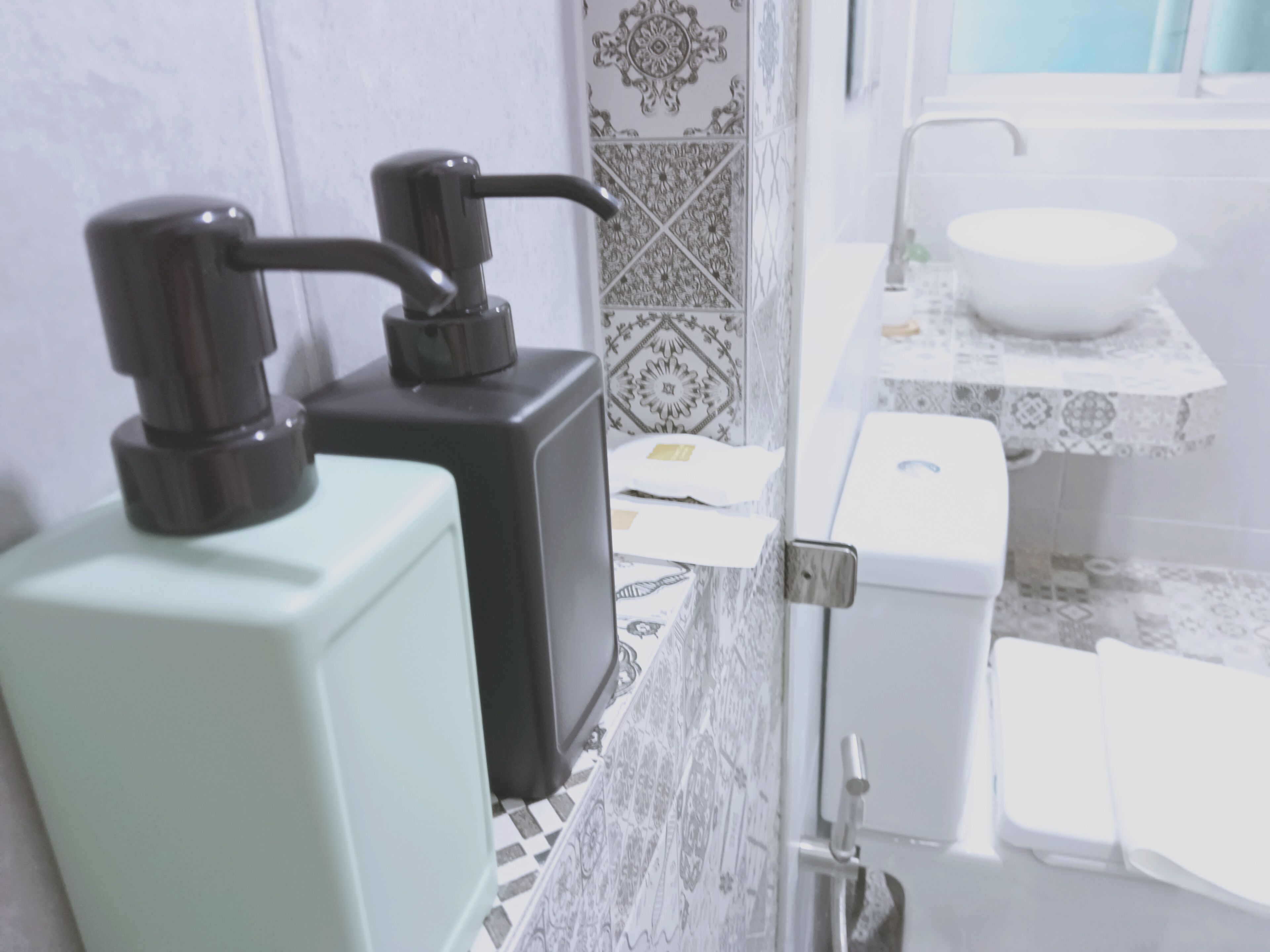 A bathroom with a toilet, a sink, and a shower.