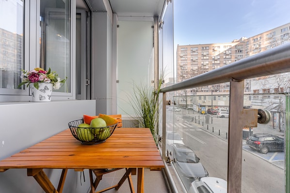 Enjoy a peaceful retreat with a balcony view of the city.