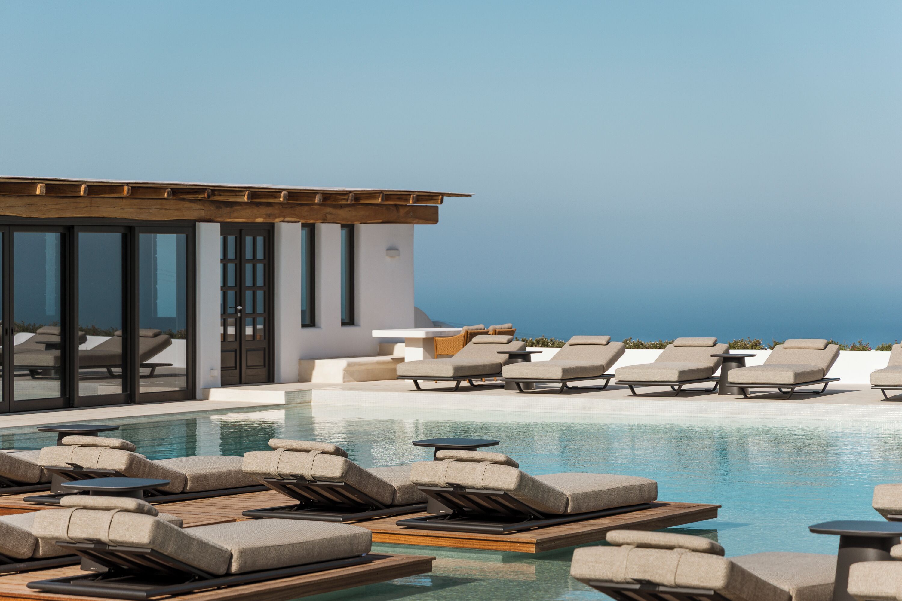 Indoor pool, seasonal outdoor pool, pool umbrellas, pool loungers