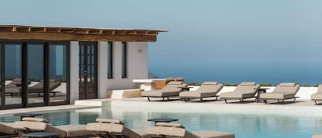 Indoor pool, seasonal outdoor pool, pool umbrellas, pool loungers
