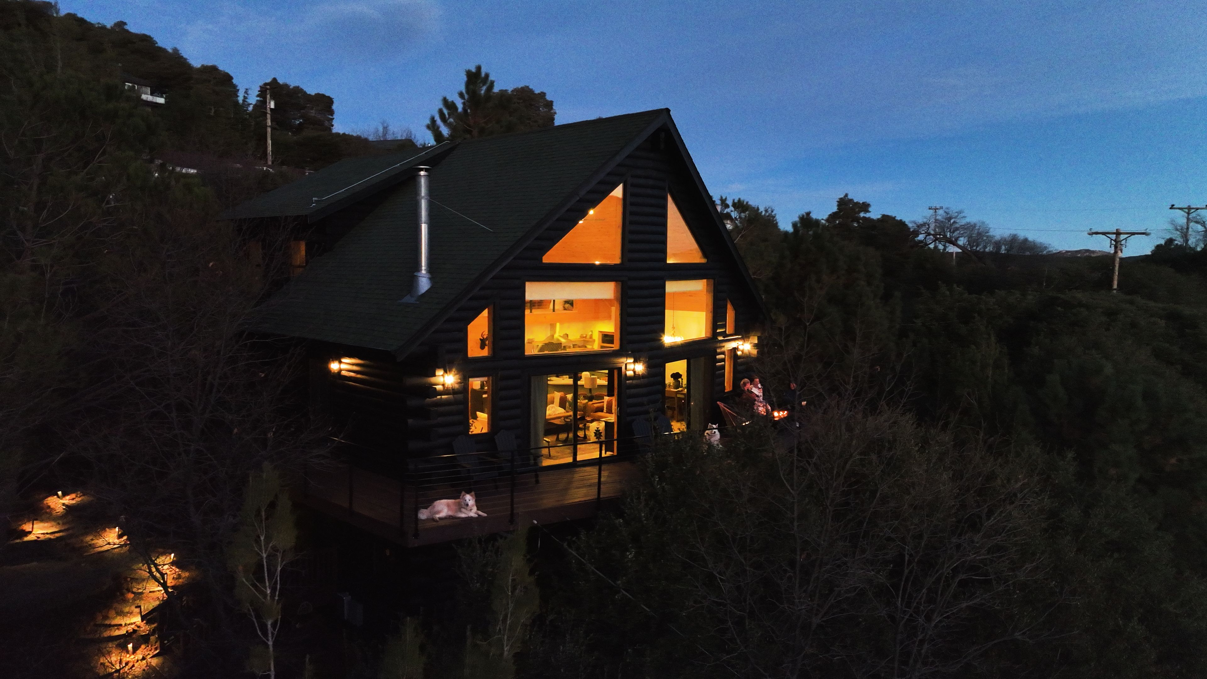 Come home to this after dinner in Julian: a warm, glowing A-frame surrounded by quiet mountain woods.
