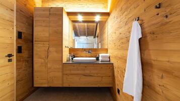 Shower, hair dryer, towels, toilet paper