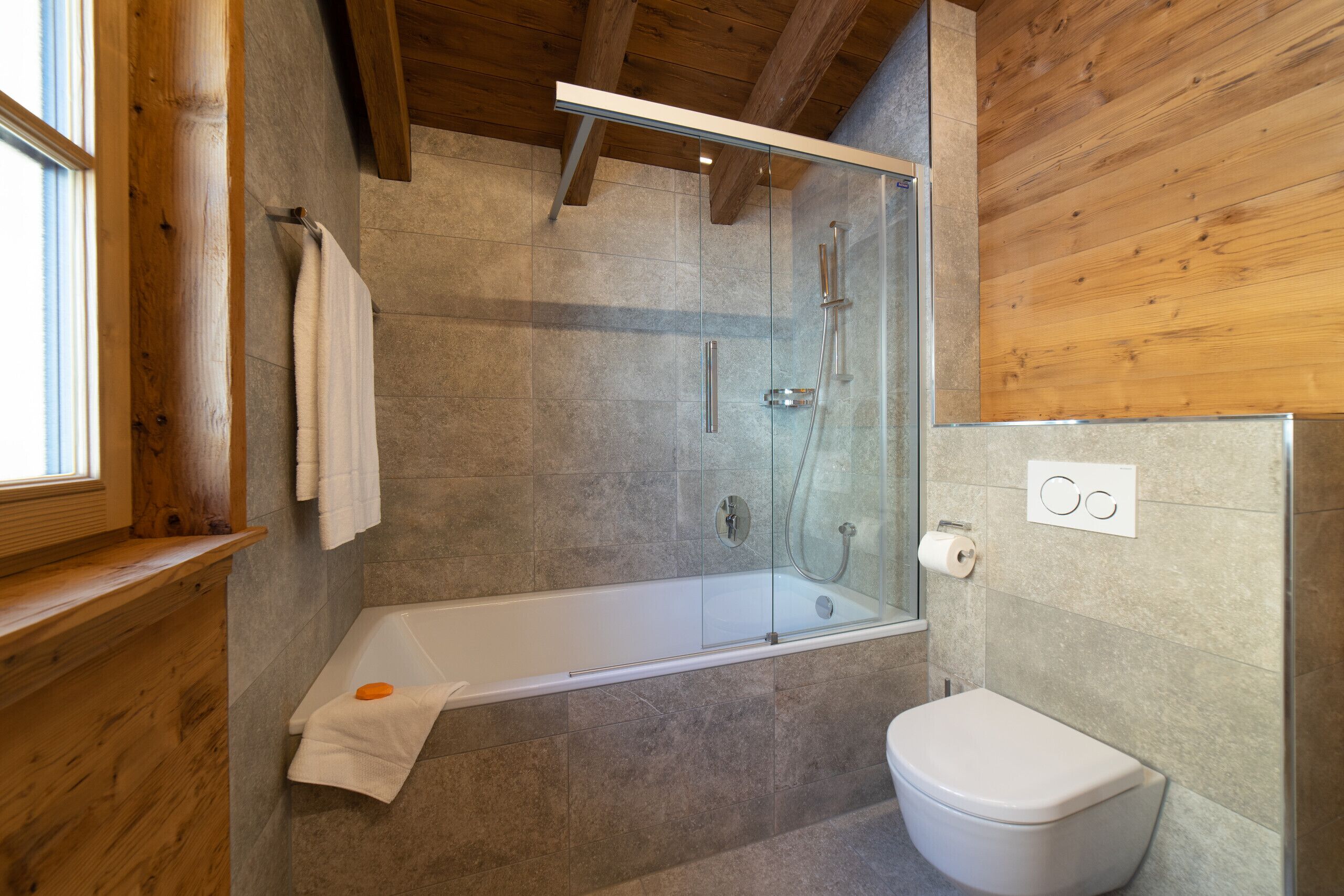 Shower, hair dryer, towels, toilet paper