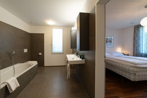 Shower, hair dryer, towels, toilet paper
