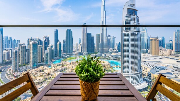 A balcony with a view of a cityscape, including the Burj Khalifa and other high-rise buildings. - Exquisite 2BR - Breathtaking BurjSkyline (Dubai)