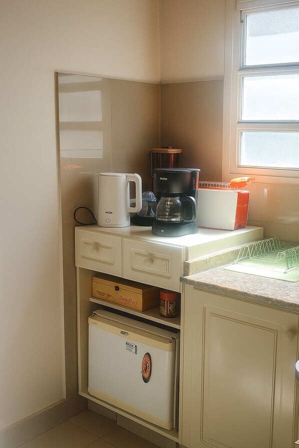 A kitchen with a coffee maker, a toaster, and a small refrigerator. - Apart for 2 Pax, Double bed or 2 Single. Obelisc Area, Colón Theatre Metro Lines (San Nicolas)
