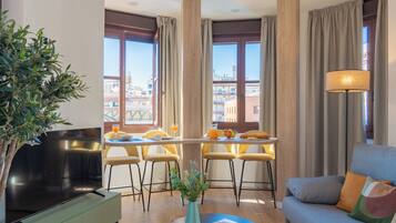 Apartment, 2 Bedrooms | Living area | 50-inch flat-screen TV with digital channels