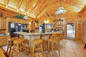 Fridge, microwave, oven, stovetop - Deer's Lair Cabin in Cedar Falls Resort - 4 bedroom, 3.5 bathroom, game room (Sevierville)
