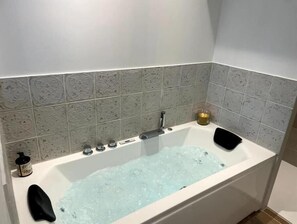 Jetted bath, hair dryer, towels, soap