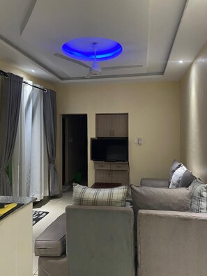 Business Apartment | Living area | 24-inch Smart TV with digital channels - Lux Suites Sunset Holiday Homes shanzu (Mombasa)