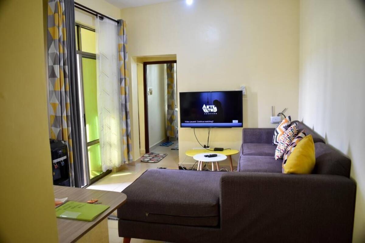 Executive Apartment | Living area | 24-inch Smart TV with digital channels