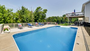 A rectangular swimming pool with a wooden deck and lounge chairs. - Home w/ Private Pool - 15 Miles to Ark Encounter! (Berry)