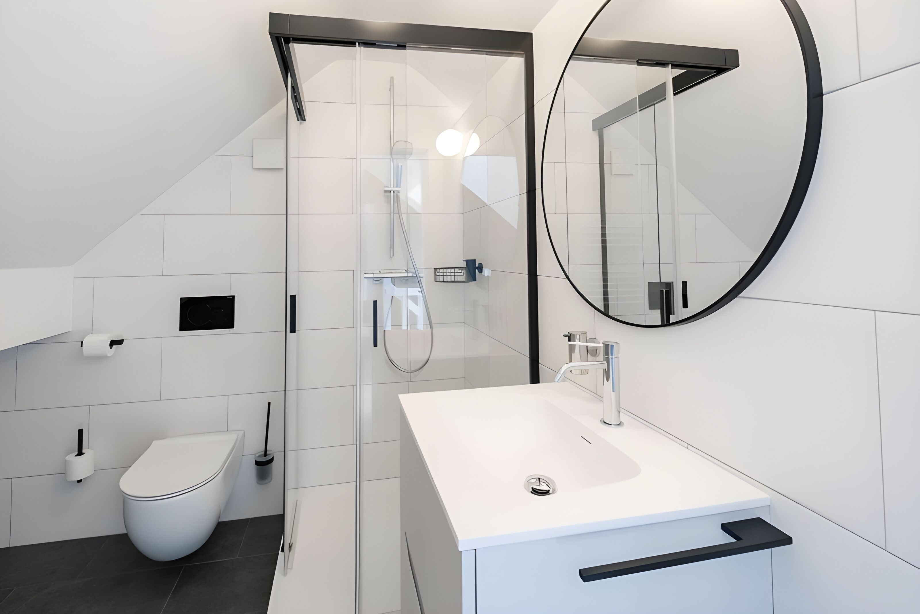 A modern bathroom with a white sink, toilet, and shower.