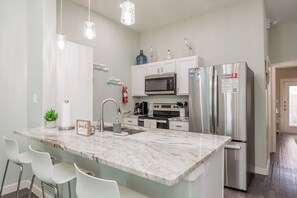 Fridge, microwave, oven, stovetop - Pet-Friendly Beach Getaway with Fenced Patio, Pool, and Pirate Playground (Corpus Christi)