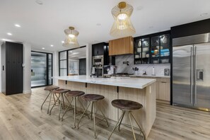 Fridge, microwave, oven, stovetop - Erwin Estate - A Perfect Blend of Modern Elegance with Mid-Century Undertones (Woodland Hills)