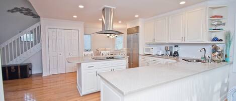 Microwave, dishwasher, coffee/tea maker, dining tables