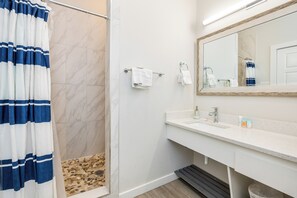 Shower, hair dryer, towels, shampoo