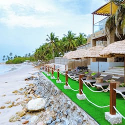On the beach, sun-loungers, beach umbrellas, beach bar