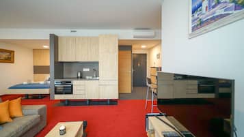 Zora Exclusive Apartment by CHORS | Living area | 82-cm LED TV with digital channels, pay films