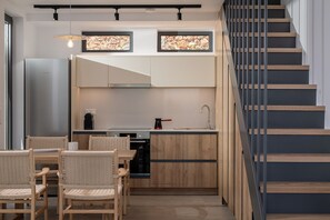 Villa | Private kitchen | Dining tables