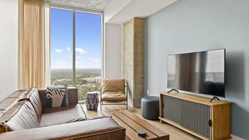 Luxury Condo, 1 King Bed with Sofa bed, Balcony, City View | Living area | LED TV, Netflix, books, streaming services